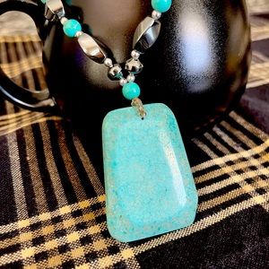 Beaded necklace with large Turquoise pendant.